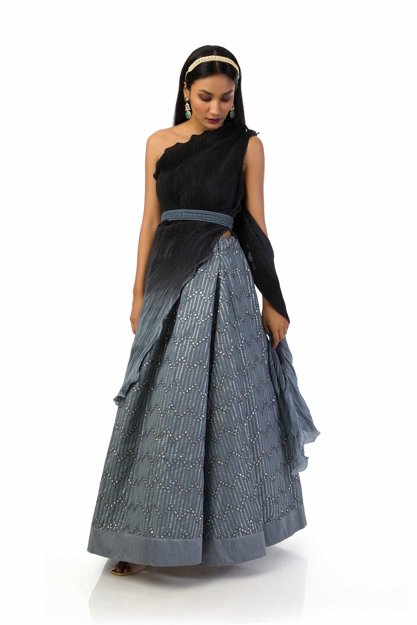 "Grey to Black One-Shoulder Top with Lehenga featuring a textured top, attached dupatta, matching belt, and a fully lined georgette skirt with sequins and thread work."