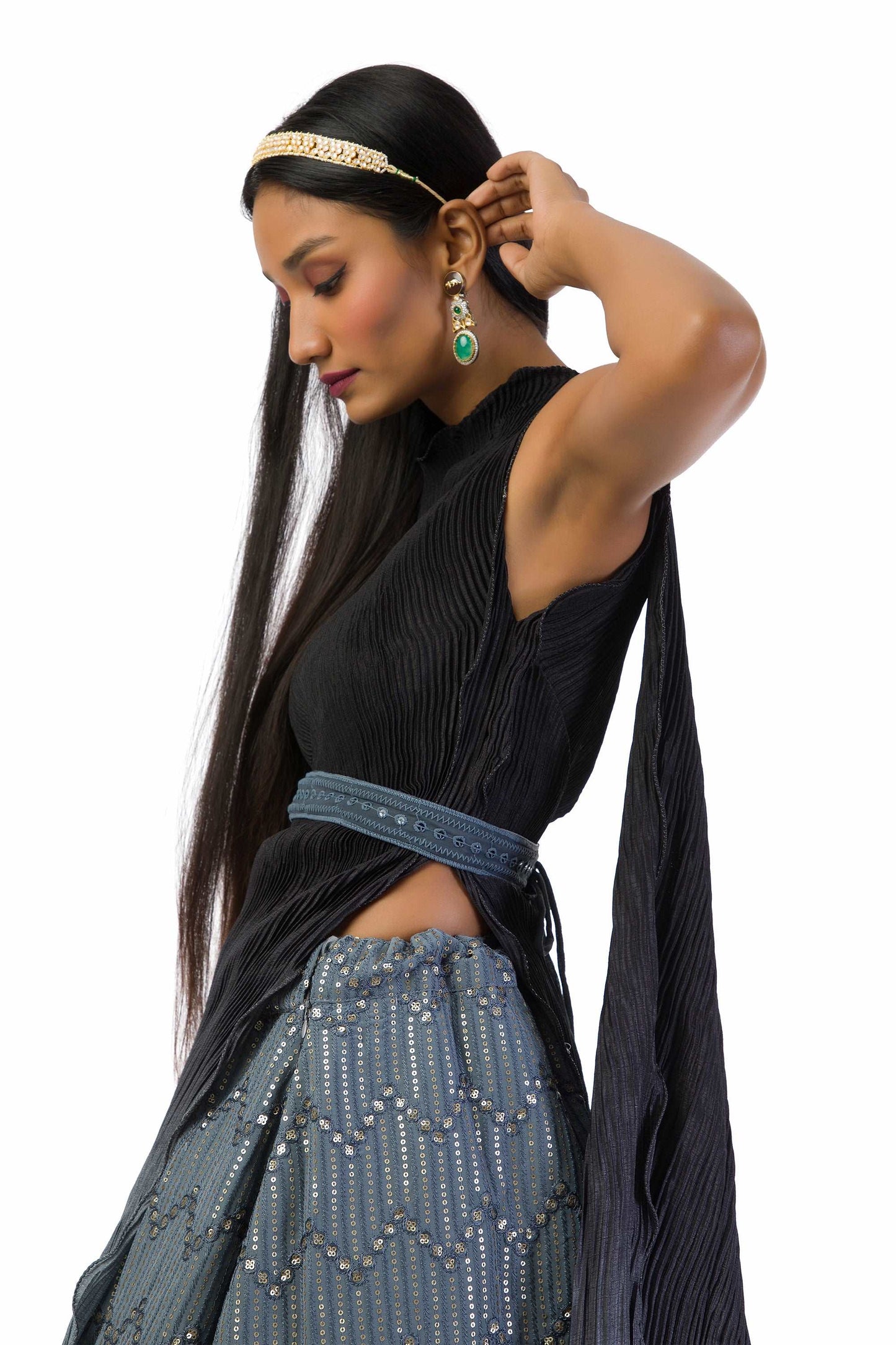 "Grey to Black One-Shoulder Top with Lehenga featuring a textured top, attached dupatta, matching belt, and a fully lined georgette skirt with sequins and thread work."