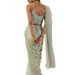 Model wearing an elegant olive green stitch drape saree set with intricate details.