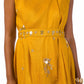 Woman wearing an elegant mustard Mahanadi dress with hand embroidery and a matching belt