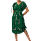 Woman wearing a bottle green one-shoulder draped gown in semi-silk with hand embroidery, paired with a matching belt.