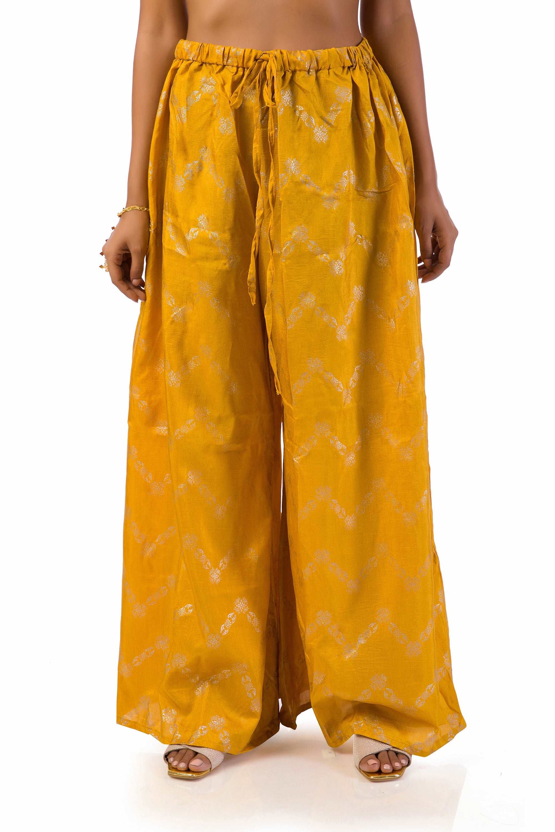 Woman wearing mustard yellow embroidered suit set with dupatta