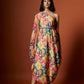 Slub linen satin & soft linen georgette multi printed one shoulder dress with open cowl sleeve and matching belt.