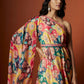 Slub linen satin & soft linen georgette multi printed one shoulder dress with open cowl sleeve and matching belt.