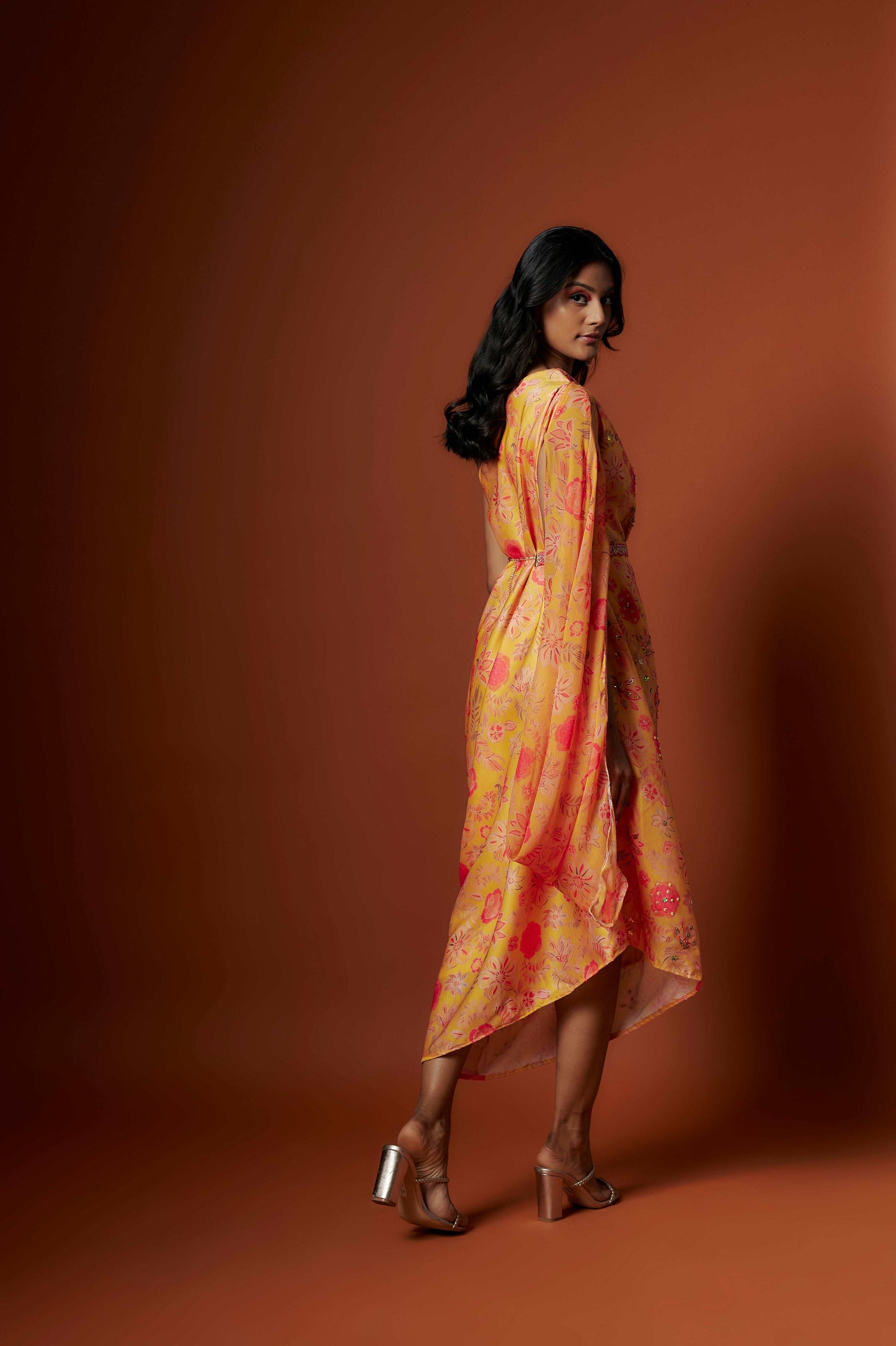 Slub linen satin & soft linen georgette yellow printed one shoulder dress with open cowl sleeve and matching belt.