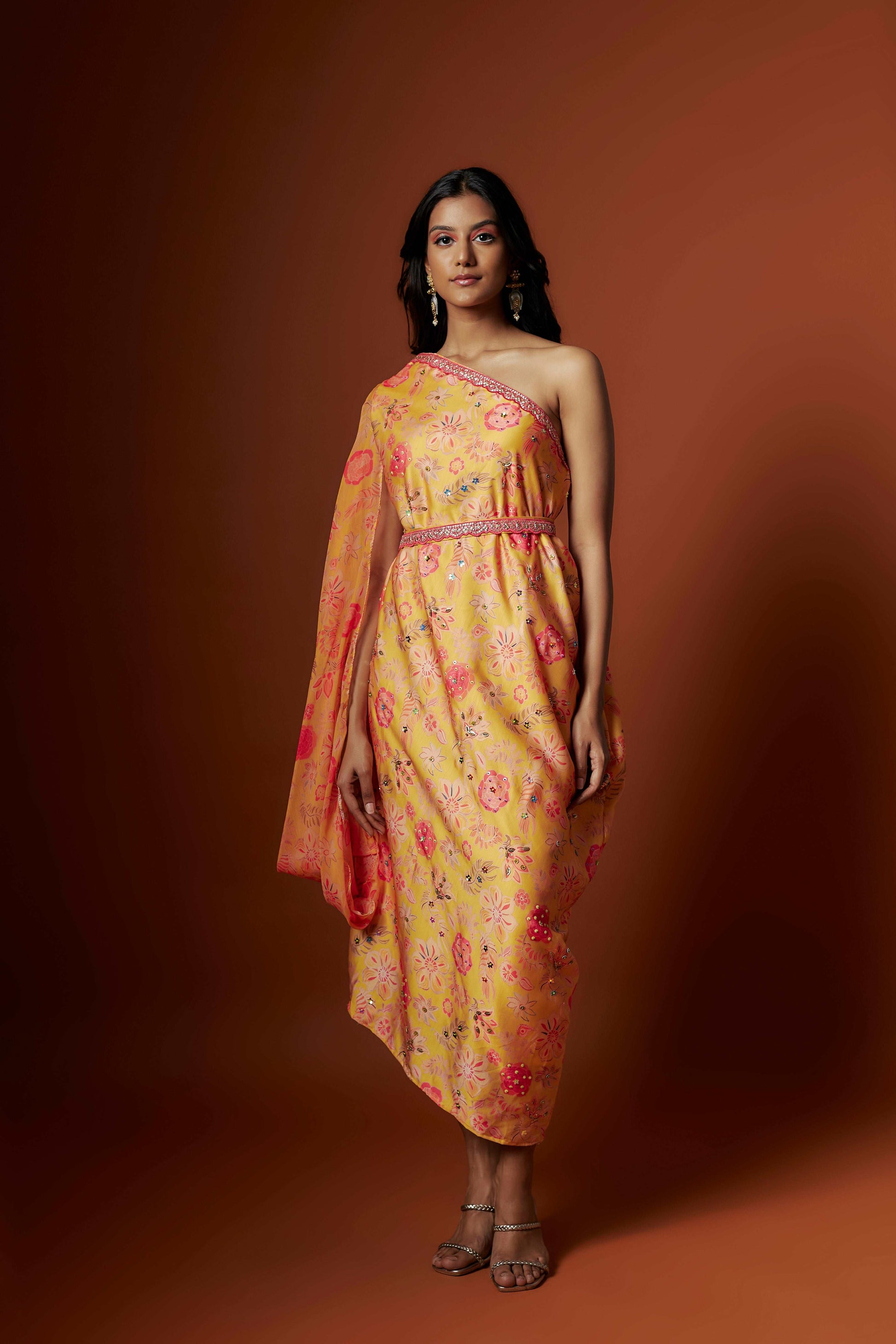 Slub linen satin & soft linen georgette yellow printed one shoulder dress with open cowl sleeve and matching belt.