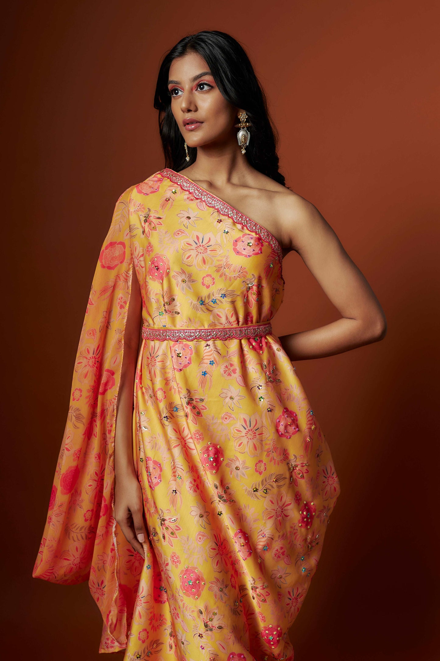 Slub linen satin & soft linen georgette yellow printed one shoulder dress with open cowl sleeve and matching belt.