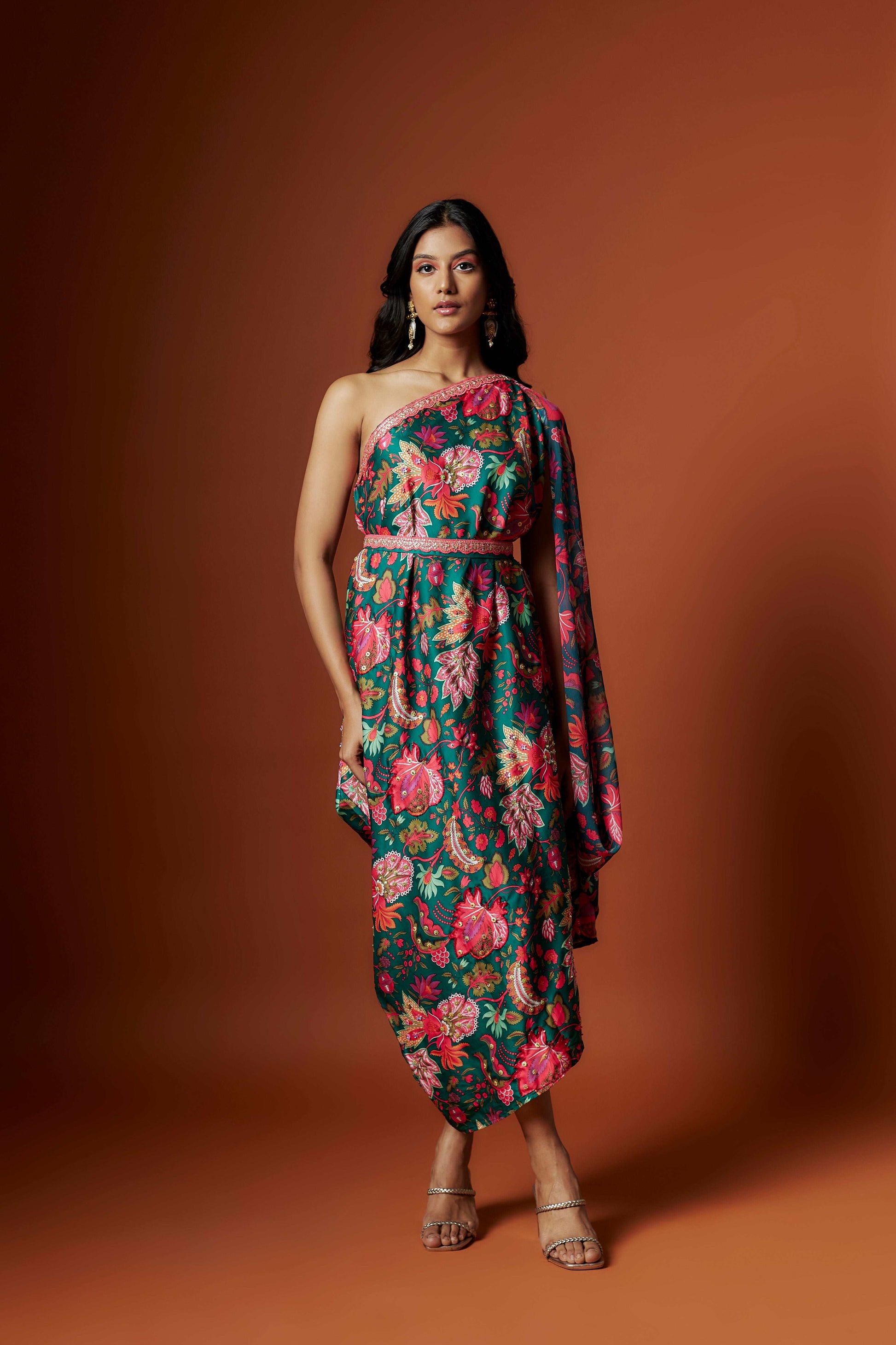 Slub linen satin & soft linen georgette green printed one shoulder dress with open cowl sleeve and matching belt.