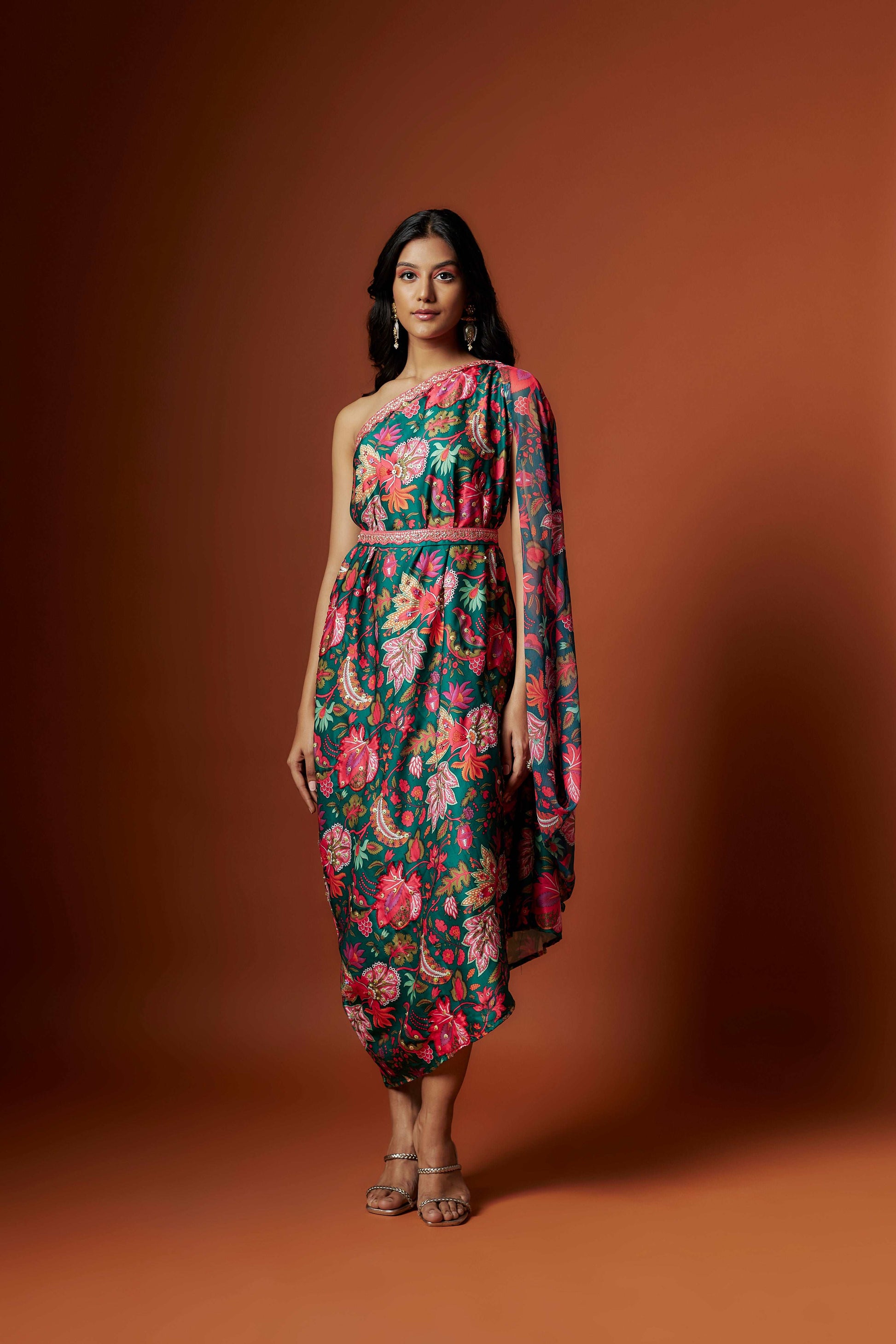 Slub linen satin & soft linen georgette green printed one shoulder dress with open cowl sleeve and matching belt.