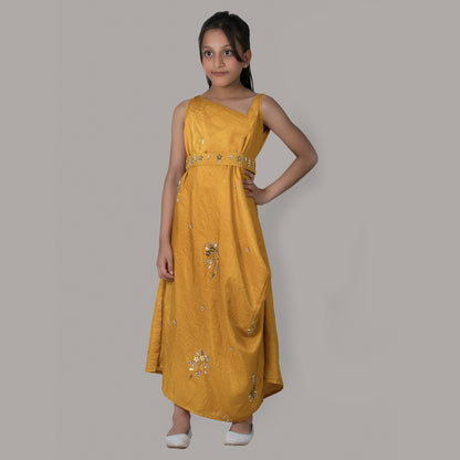 Girl wearing a mustard draped side cowl neck dress with hand embroidery and a matching belt